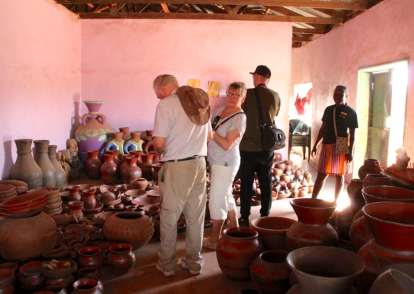 Alexandra's Africa Guests inside Mukondeni Pottery Shop - selecting a few curios to take home