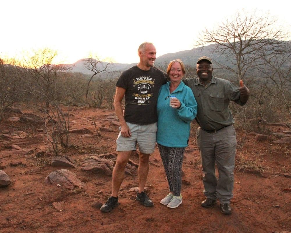 two guests on a hike with a ranger