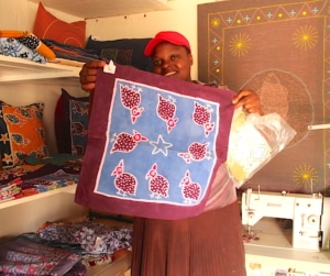 The manager Florence Ngobeni holds up samples of the beautiful finished products