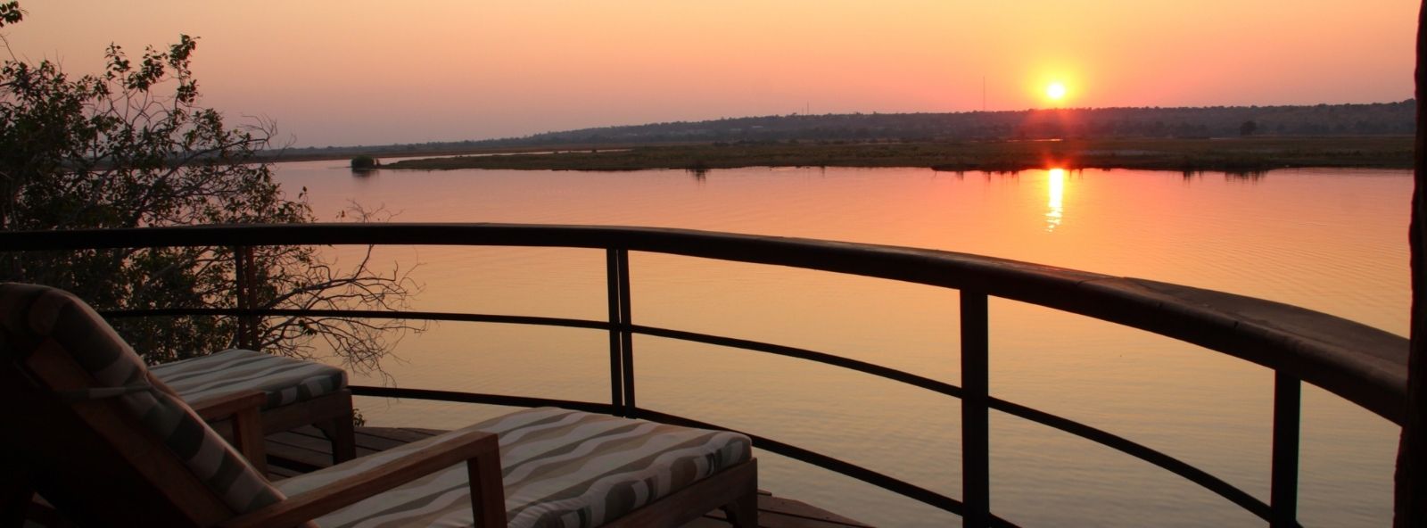 Enjoying a Chobe River Sunset Enjoying a Chobe River Sunset - view from guests balcony over the Chobe River enjoying the sunset in the distance