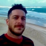 Headshot of Jonathan Hemmings with sea shore in background