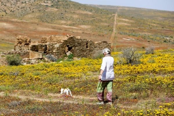 woman walking in the wildflowers of Namaqualand